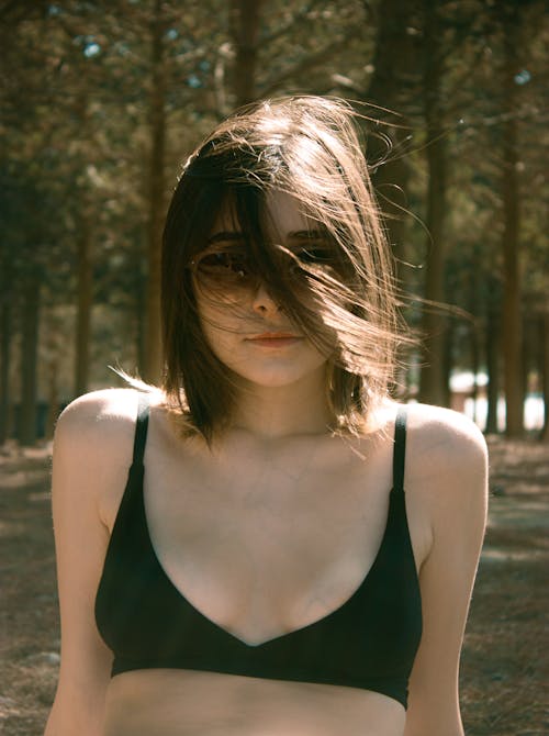 Young Woman Wearing a Bikini and Sunglasses 