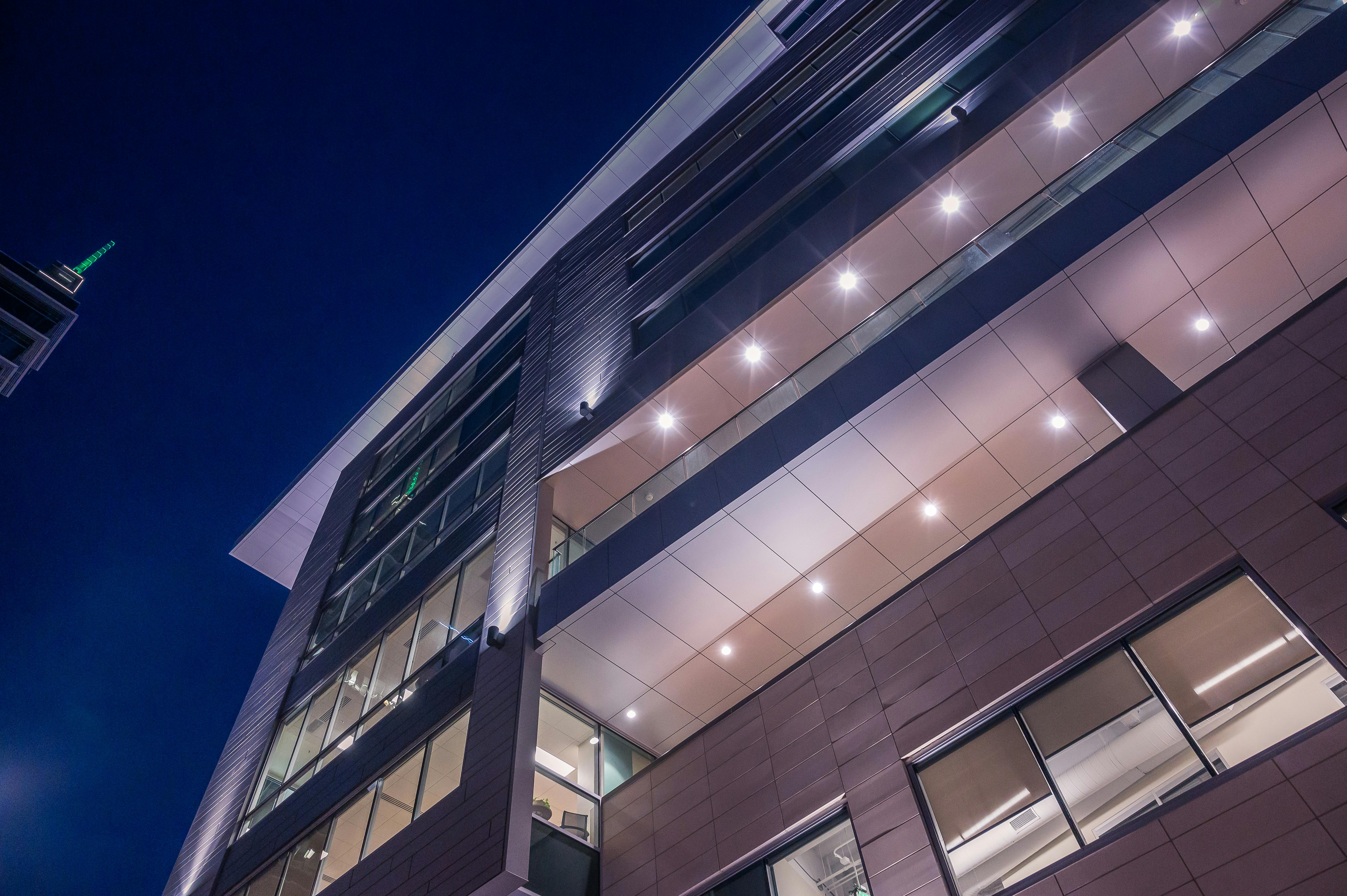 Image Name Energy-efficient LED landscape lights illuminating a commercial property at night