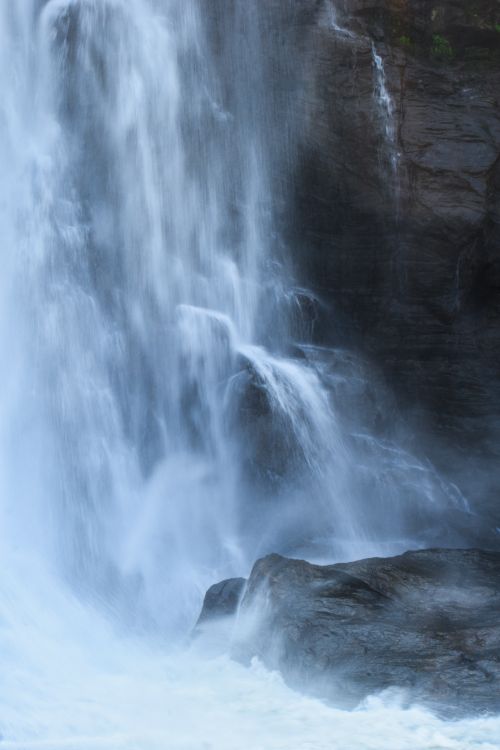 Free Stunning waterfall cascading over rocks in Thrissur, Kerala, capturing nature's beauty. Stock Photo