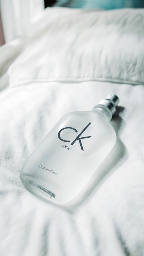Bottle of Perfume on Bed