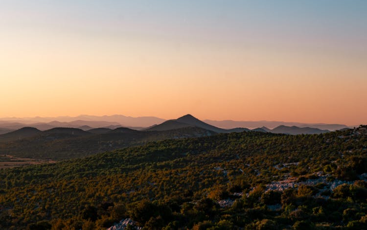 Silhouettes Of Mountains At Dawn