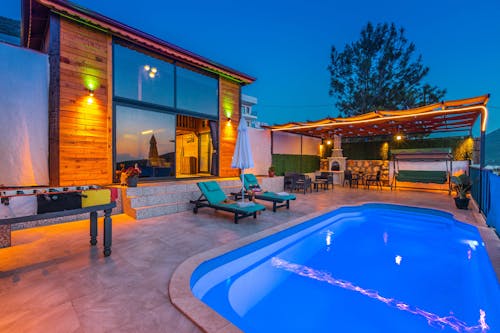 Deckchairs by Swimming Pool in Yard