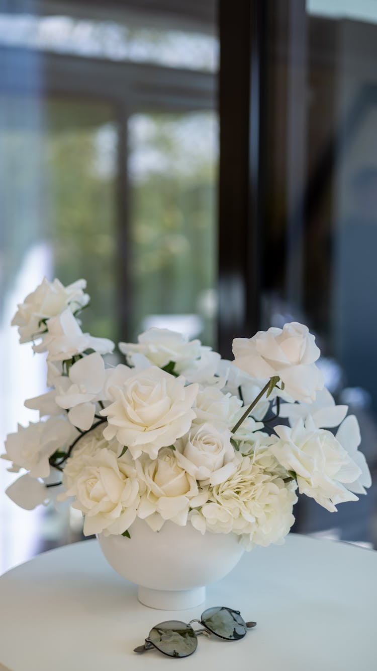 White Flowers In Vase On Table