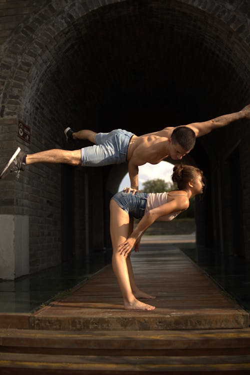 Acrobat Balancing on His Hand Supported on His Partner