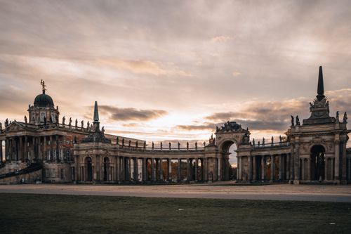 Free Stunning view of New Palace's baroque architecture in Potsdam at sunset, showcasing majestic entrance gates. Stock Photo