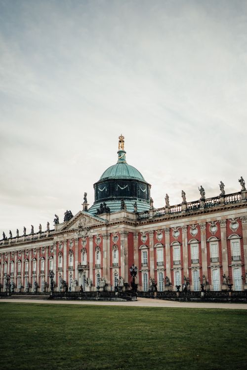 Free Elegant Baroque architecture of the New Palace in Potsdam, Germany, under a cloudy sky. Stock Photo