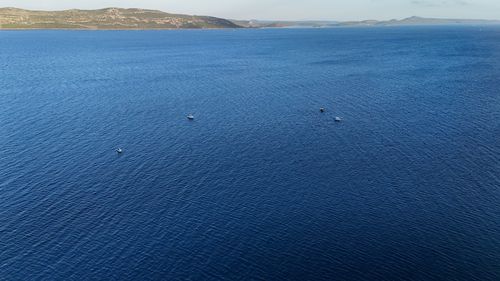 Free Scenic aerial view of boats floating on the Adriatic Sea near the coast of Veneto, Italy. Stock Photo