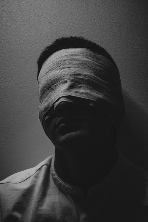 Man with His Eyes Covered with a Bandage