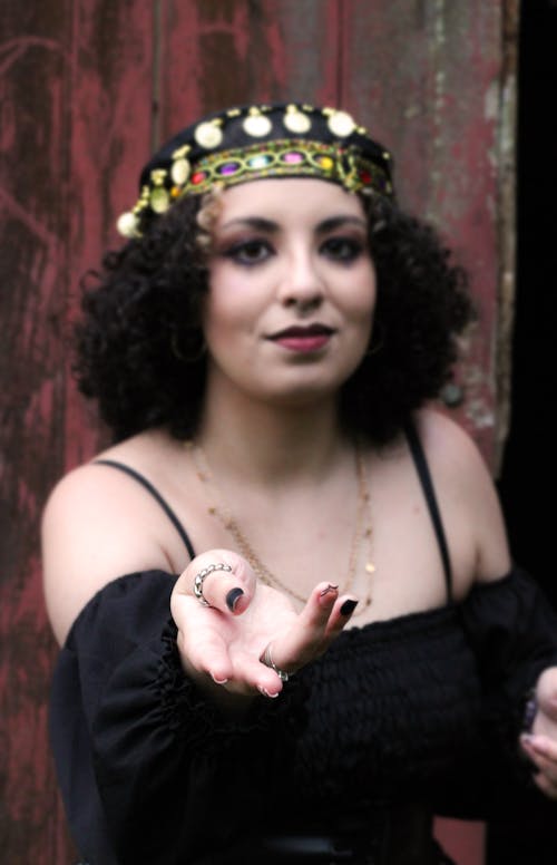 Young Woman in a Black Blouse and a Headdress 