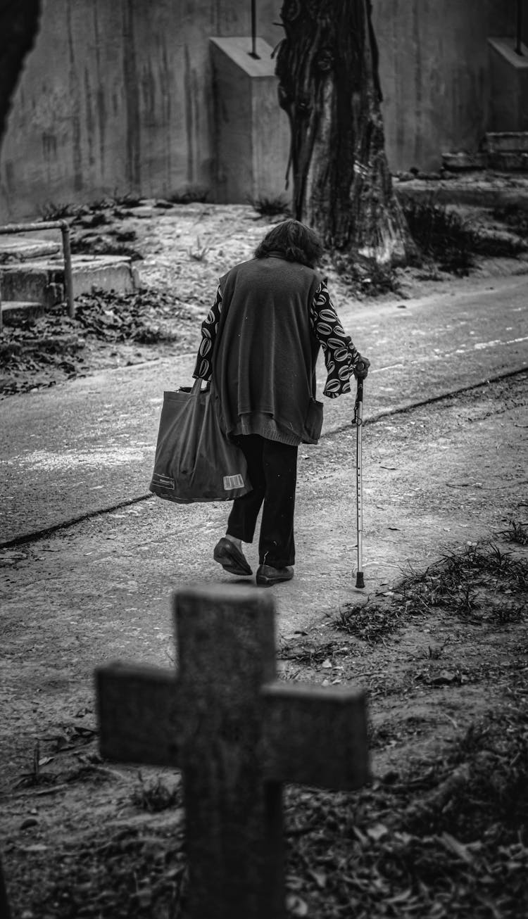 Elderly Woman Walking With Cane