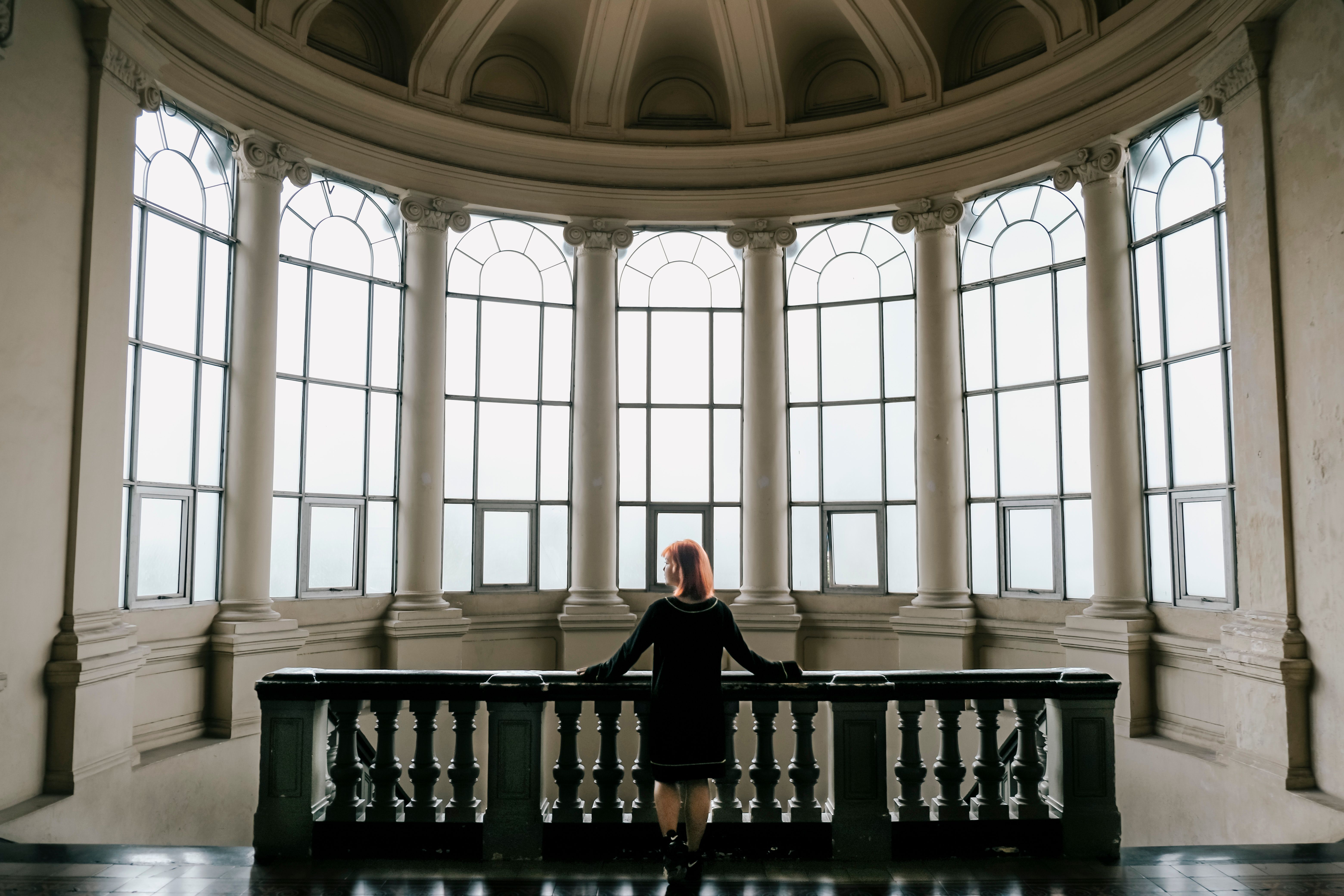 Woman in Front of Windows in Museum · Free Stock Photo