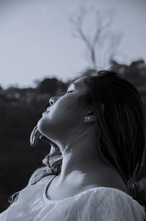 Free Peaceful side view of a woman with eyes closed, embracing nature in São Paulo. Stock Photo
