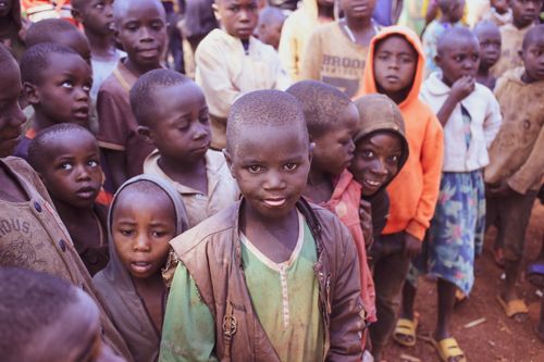 Free A diverse group of African children standing outdoors, smiling and interacting. Stock Photo