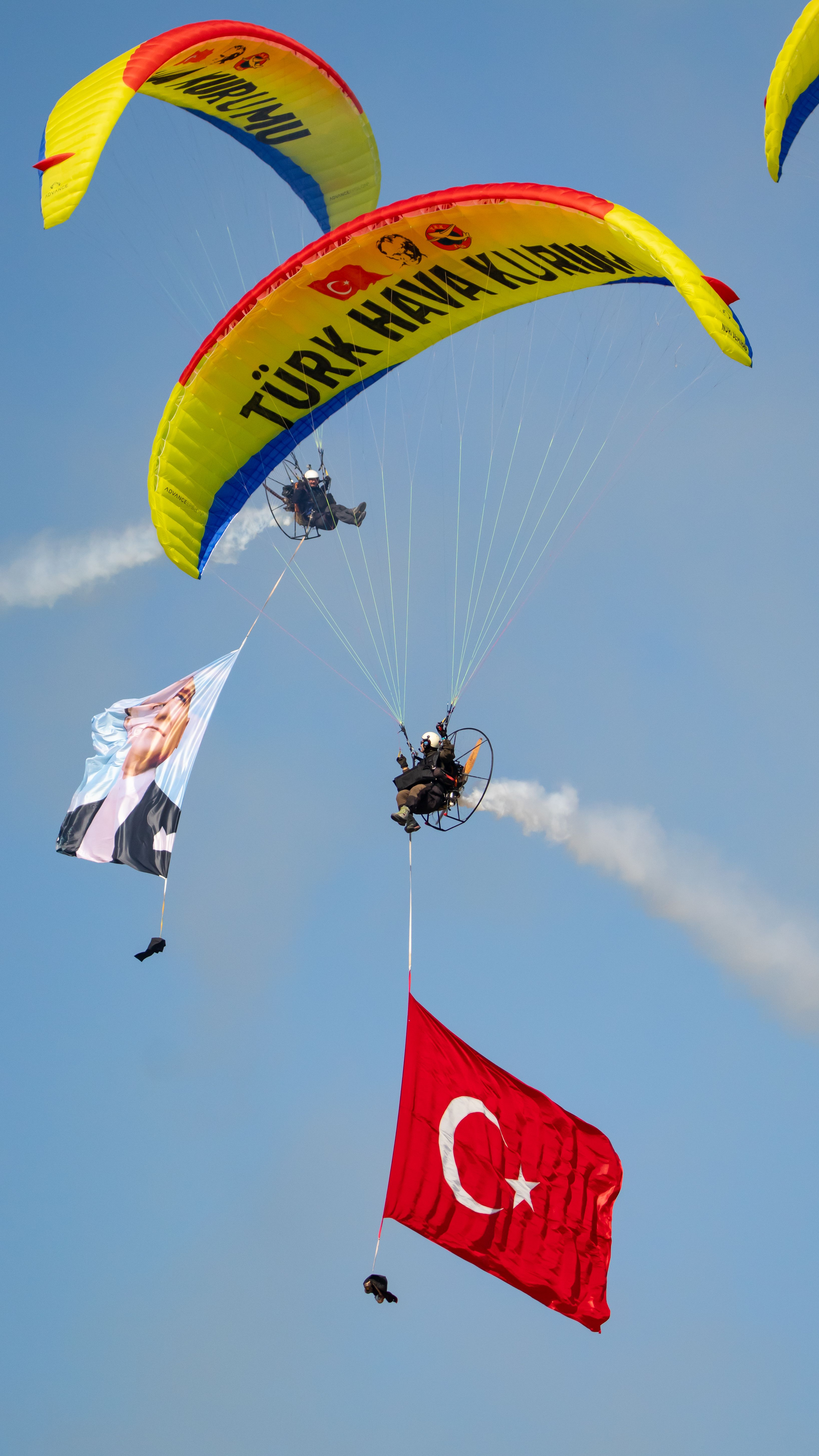 A vibrant paragliding display with the Turkish flag in İzmir, Türkiye.