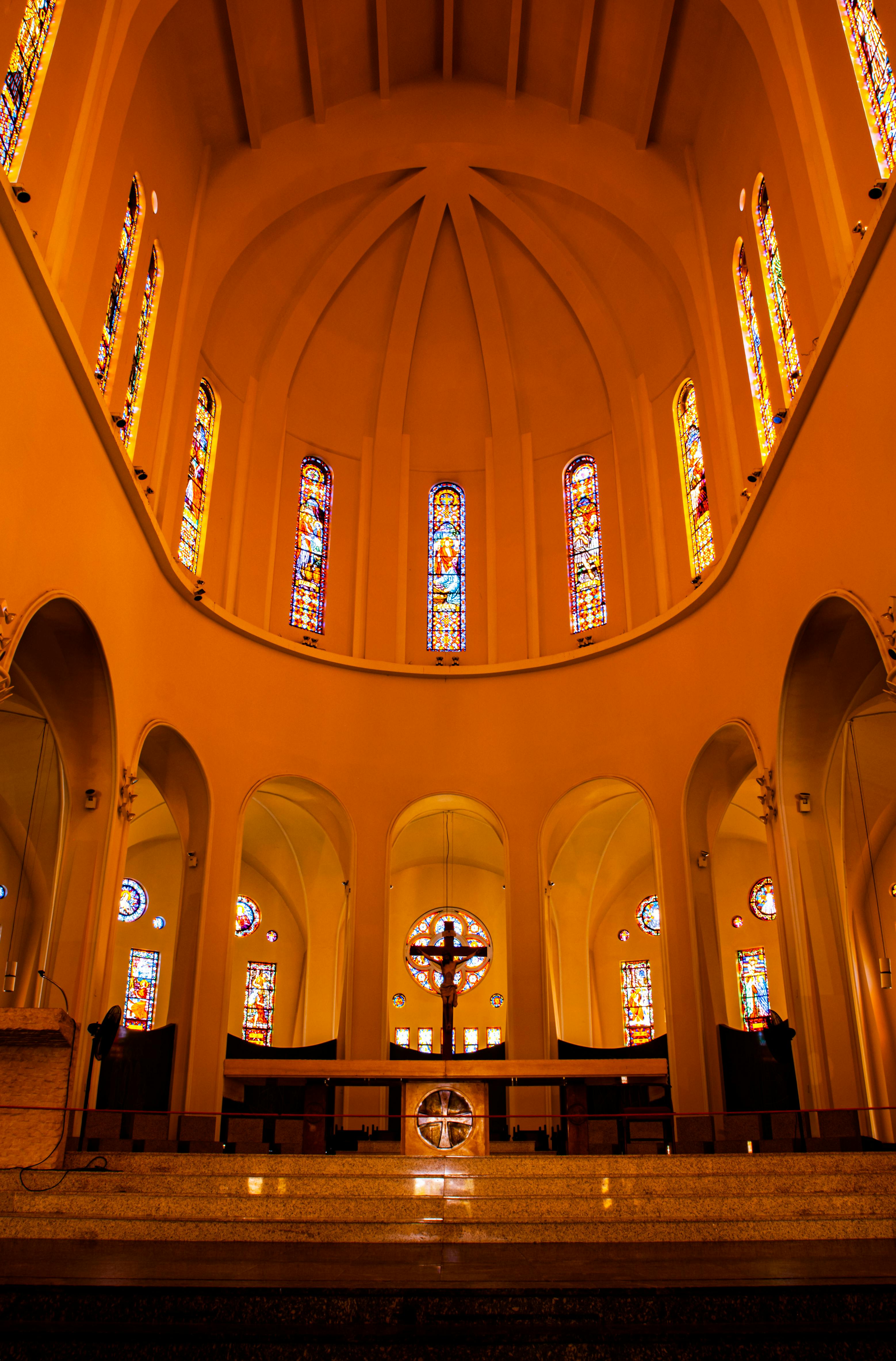 View of Empty Tables and Chairs in a Room with Arches in a Church · Free Stock Photo