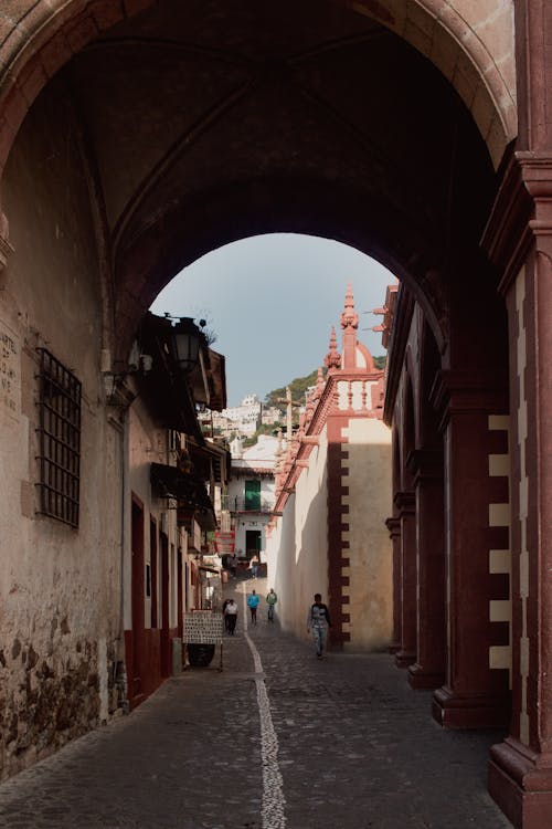 Narrow, Cobblestone Street with Tunnel in Town