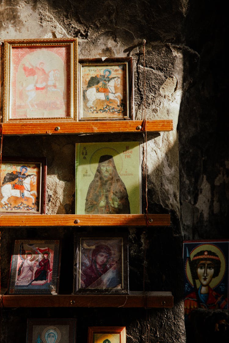 Orthodox Framed Pictures Of Saints In Frames On Shelves In Old Monastery