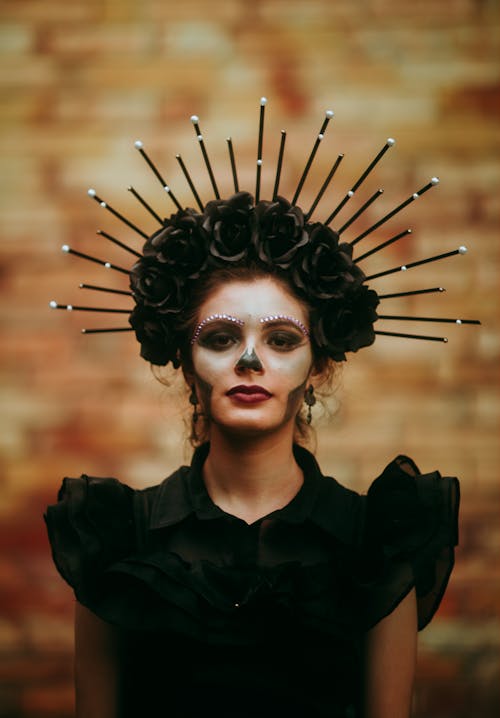 Portrait of a Young Woman in a Halloween Costume and Makeup 