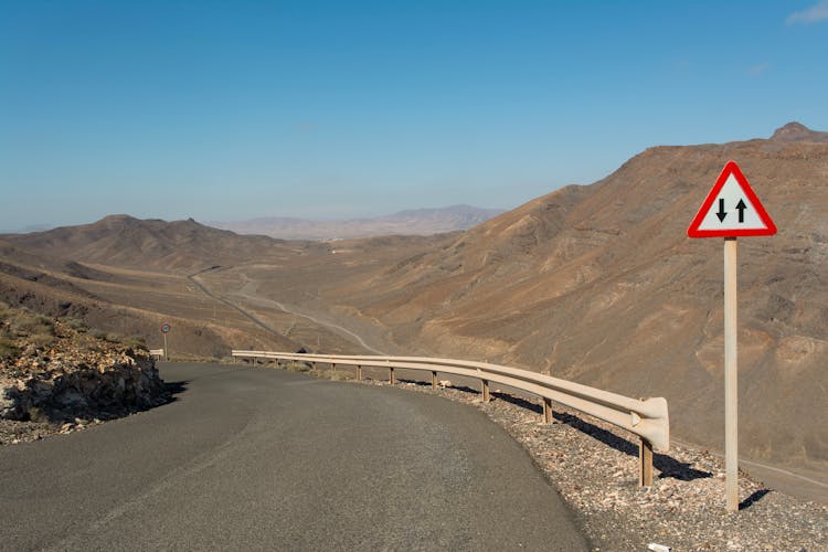 Road Sign By The Road In The Desert 