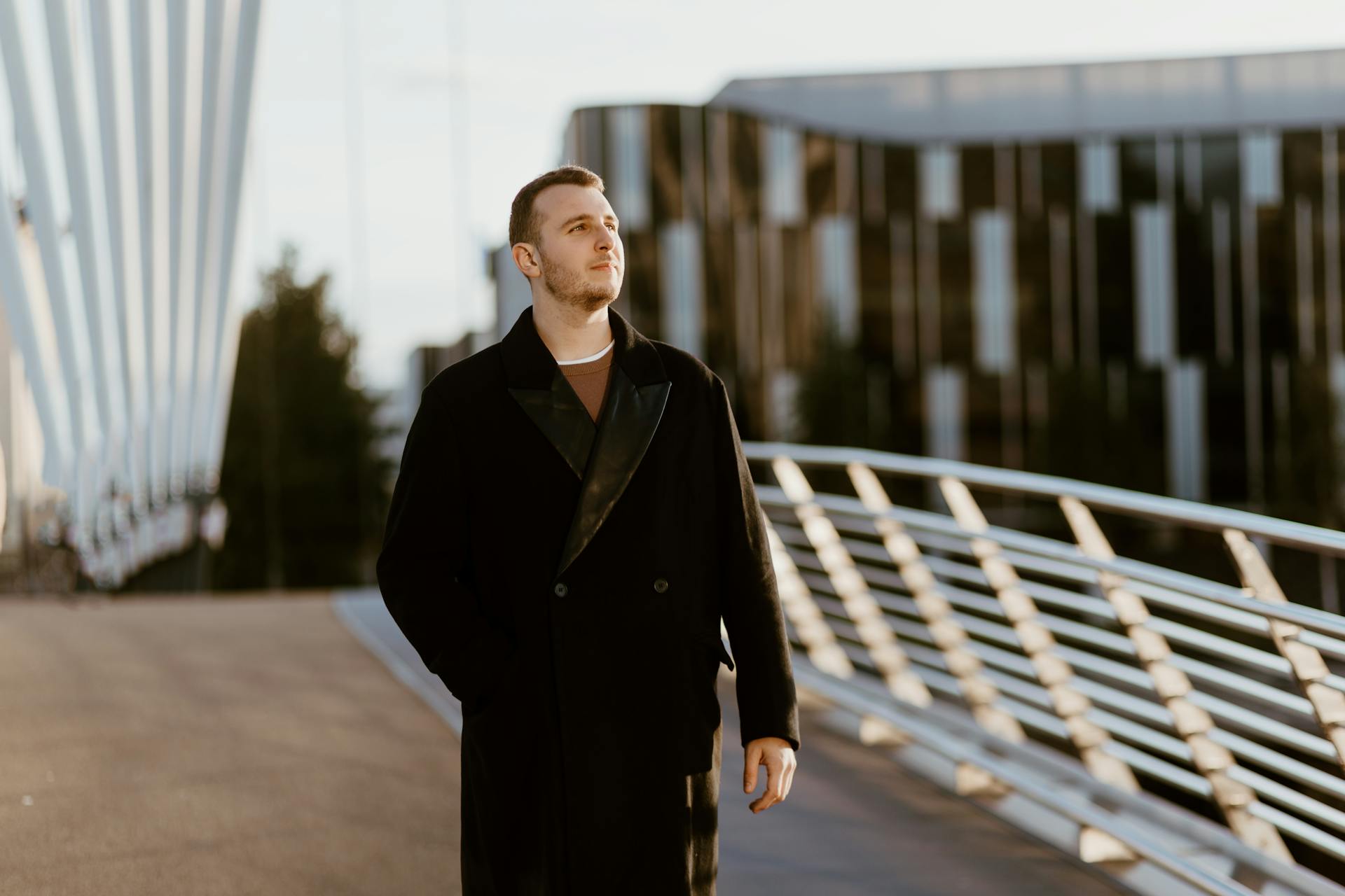 Man in Black Warm Woolen Double Breasted Coat Walking Bridge