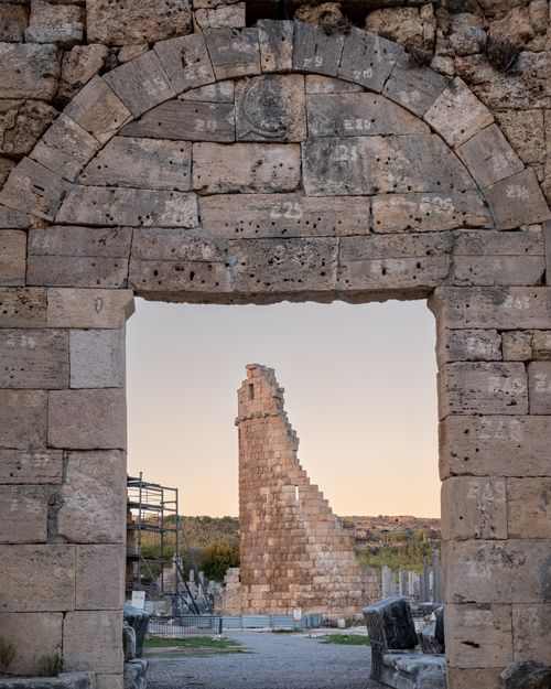 Free Explore the majestic ancient ruins and arches of Antalya, Türkiye at sunset, showcasing historic architecture. Stock Photo
