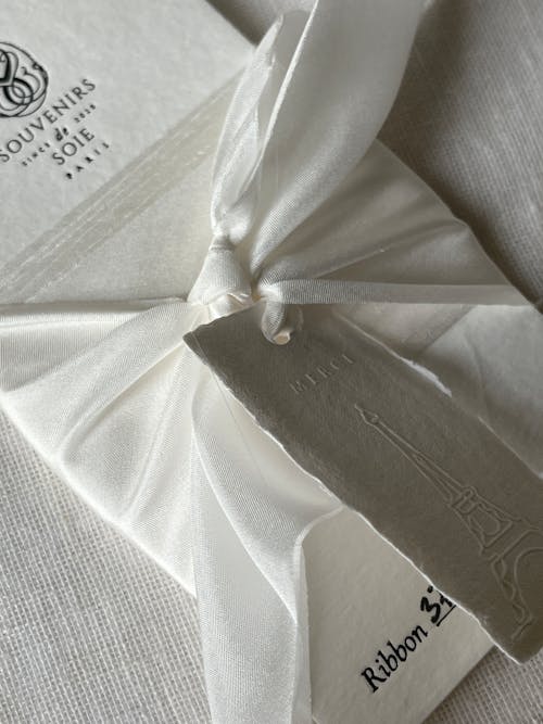 White Greeting Cards Tied with a Ribbon 