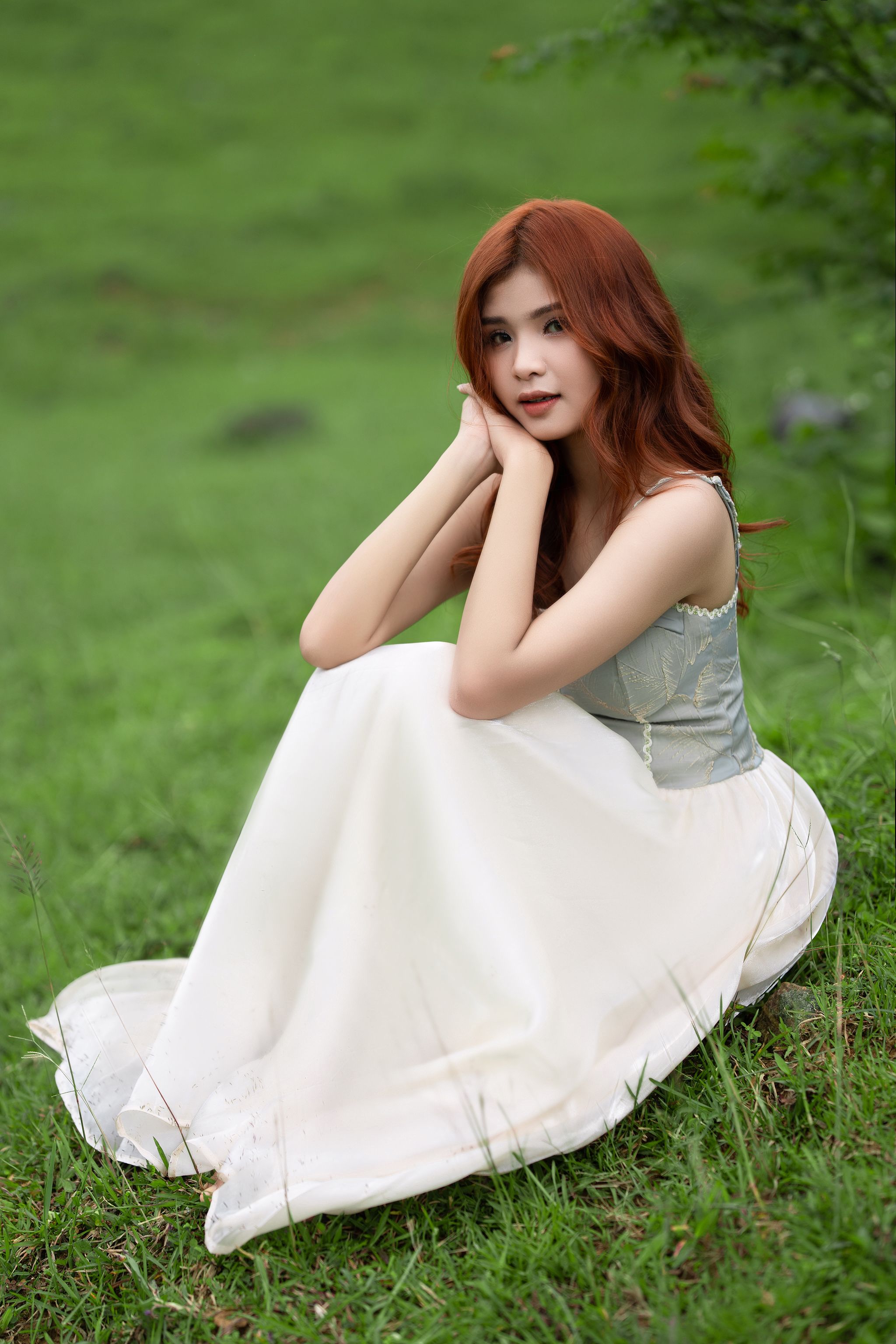 Woman in Dress Sitting on Grass · Free Stock Photo