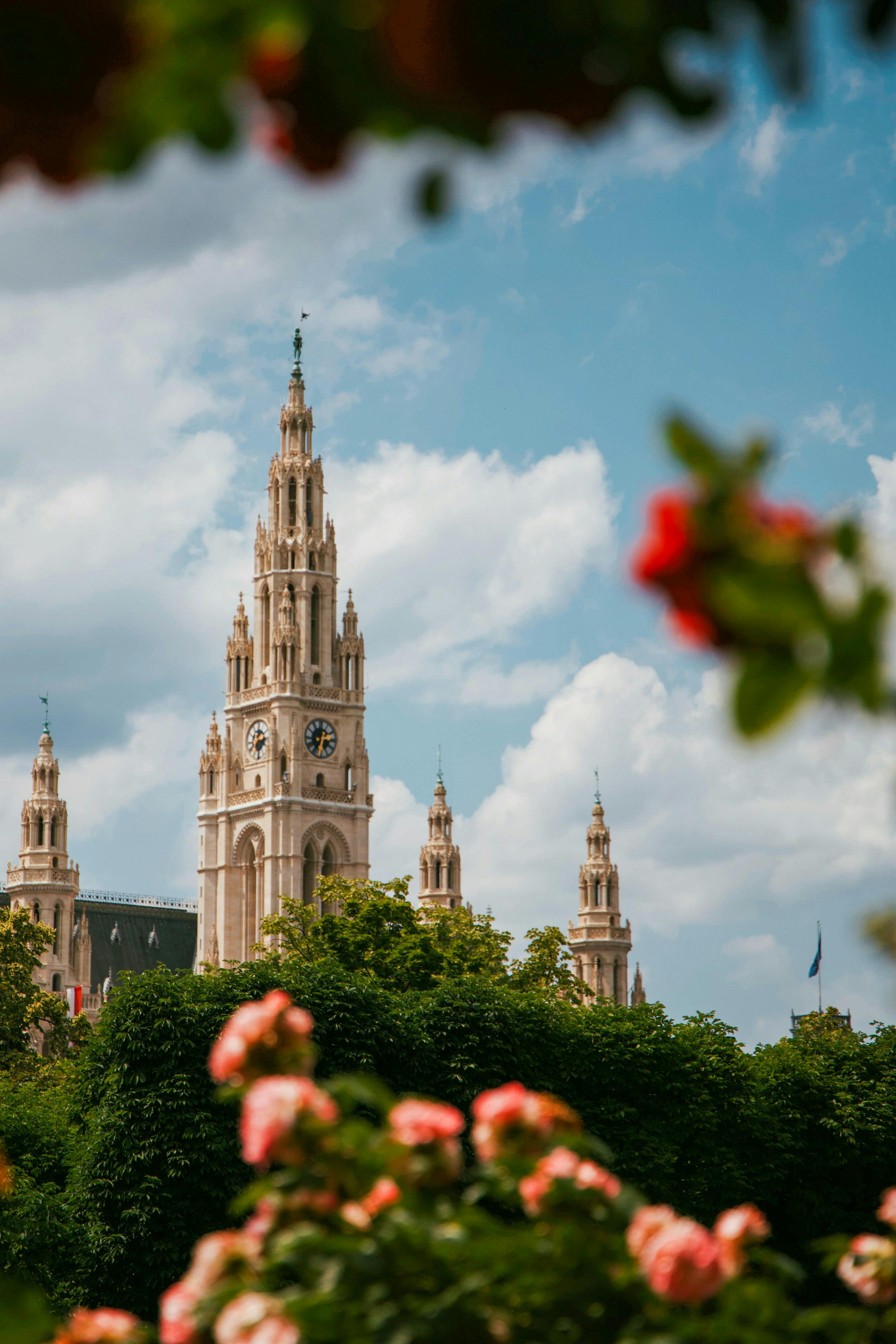 Stunning view of the Vienna City Hall surrounded by lush gardens, captured in vibrant color.