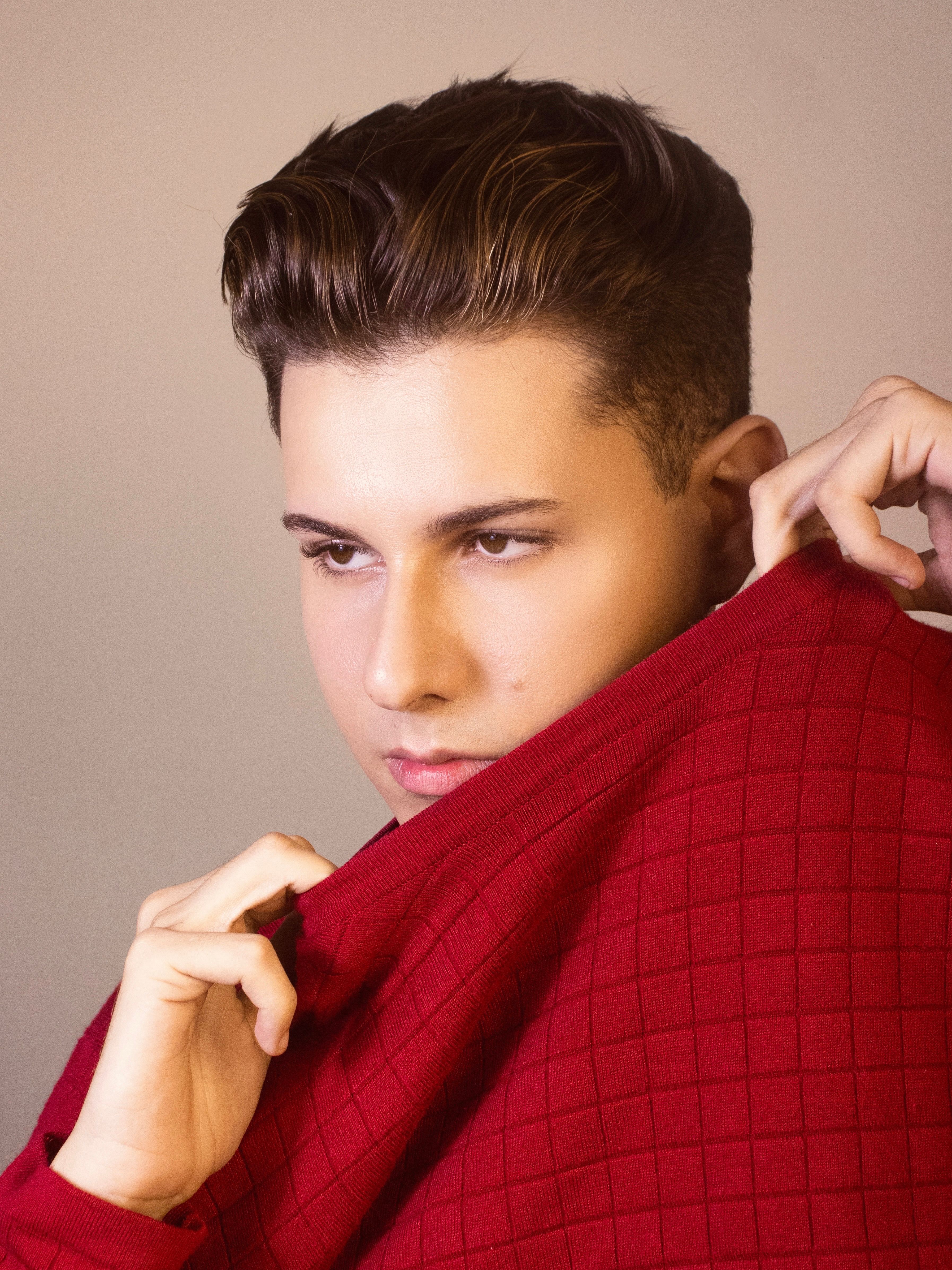 Young Man in a Red Sweater · Free Stock Photo