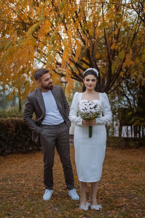 Newlyweds Together in Park in Autumn