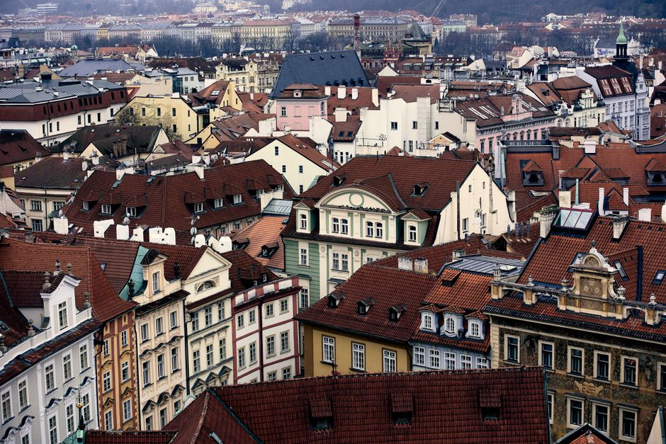 Charming aerial view of Prague's historic rooftops showcasing traditional Czech architecture.