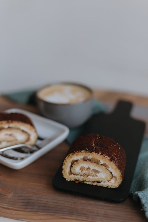 Cake and Coffee Served on a Table 