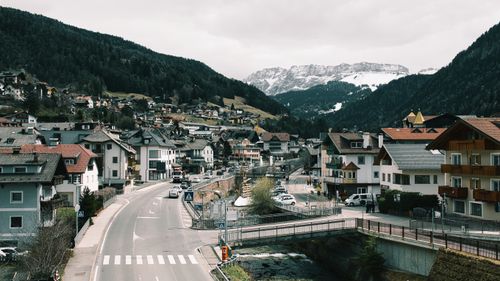 Free Panoramic view of Sankt Ulrich with snowcapped mountains in Trentino-Südtirol, Italy. Stock Photo