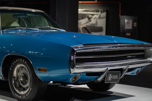 Vintage blue Dodge Charger showcased at an exhibition in Baku, Azerbaijan.