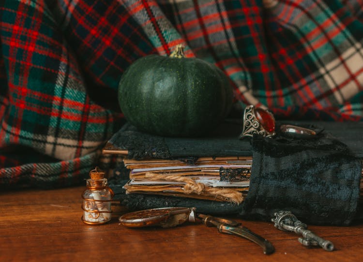 Green Pumpkin And On Ring On Old Manuscript