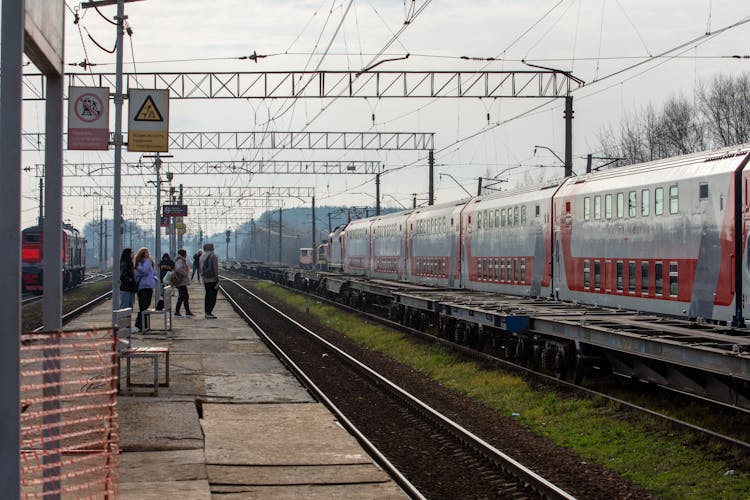 People Waiting At Railway Station