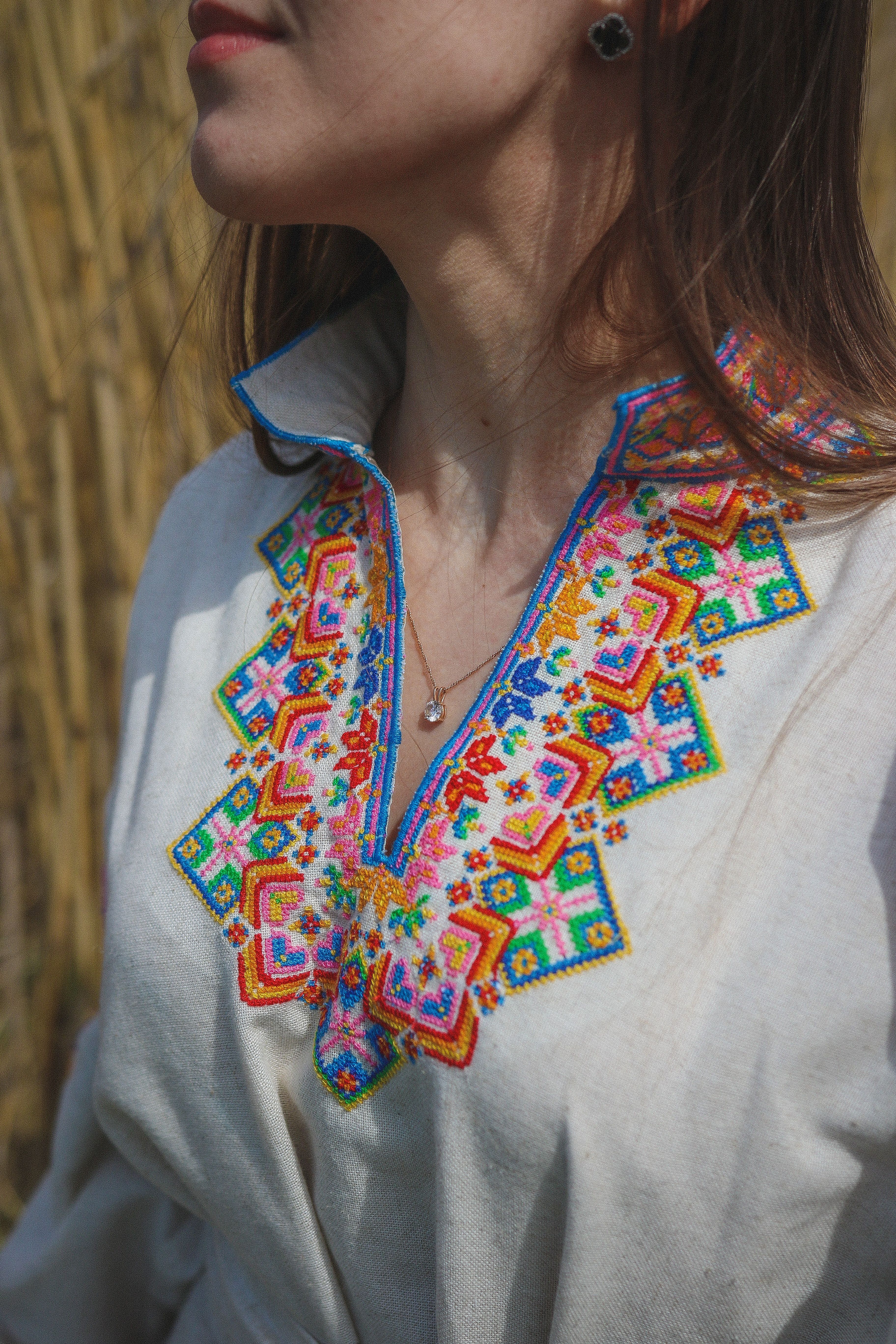 A close-up of a traditional Ukrainian blouse with intricate, colorful embroidery.