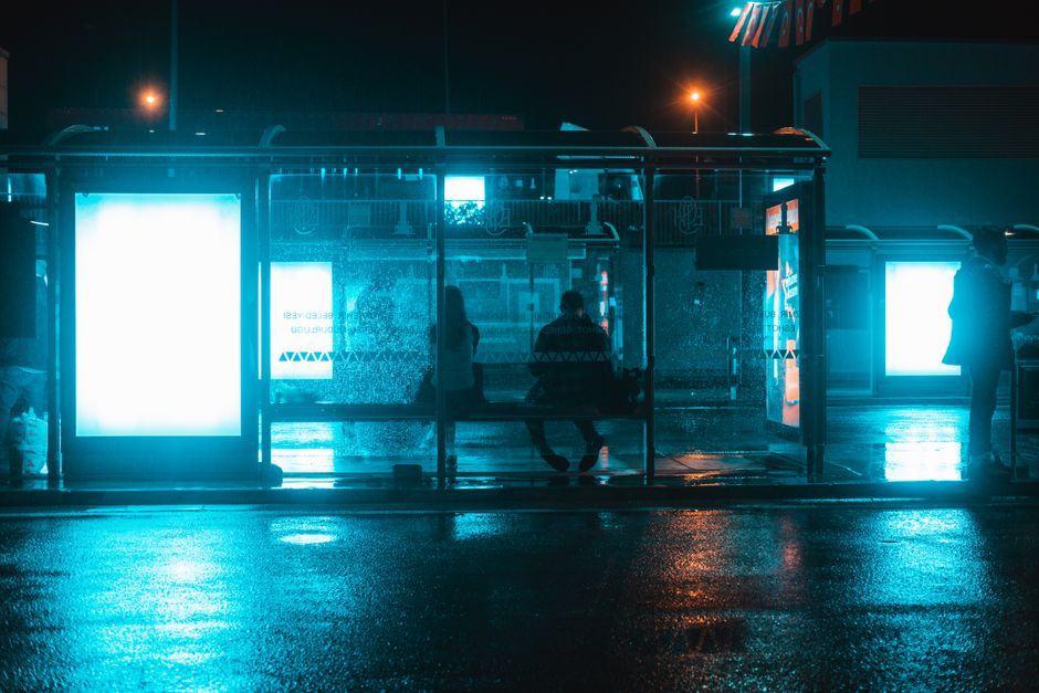 A bus stop in Vilnius, Lithuania, with a digital display showing real-time schedules, indicating easy urban navigation.