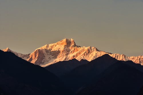 Snowcapped Peak and Mountains Silhouette