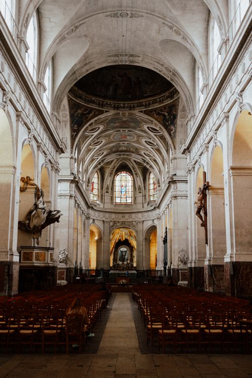 Free A stunning view of the baroque architecture inside Saint-Roch Church, Paris, showcasing exquisite details and art. Stock Photo