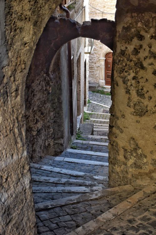 Free Explore a cobbled alley with ancient stone steps in Castel del Monte, Abruzzo, Italy. Stock Photo