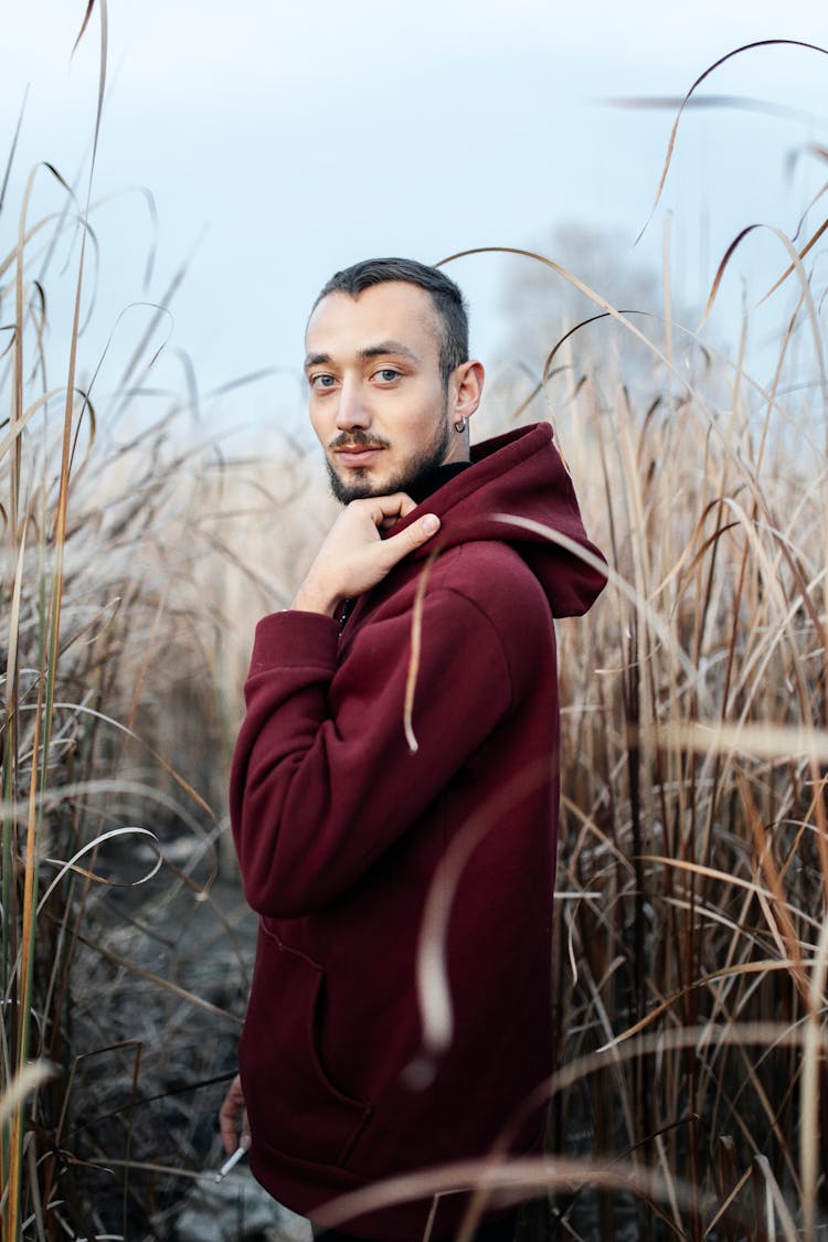 Man In Red Hoodie In Grasses