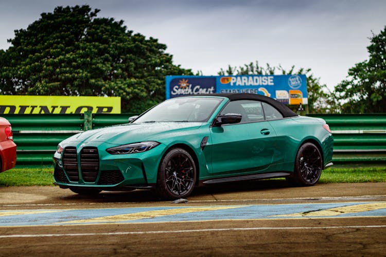 Green Sports Car On A Race Track