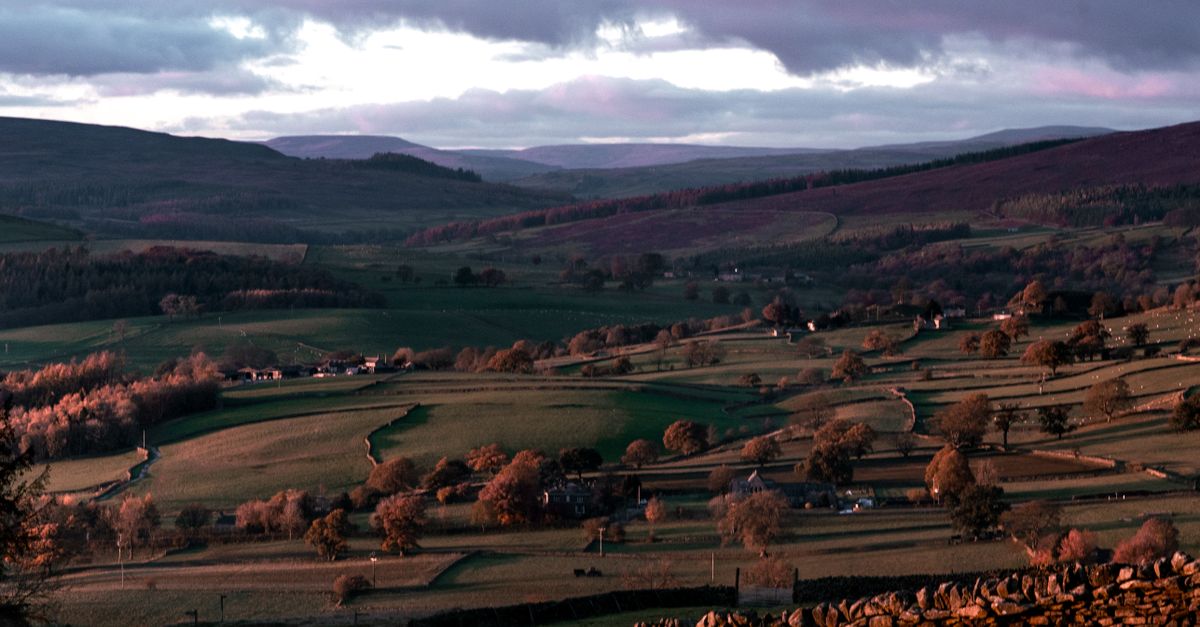 Remote Rural Valley Rural Rolling Valley Landscape with Distant Mountains · Free Stock Photo