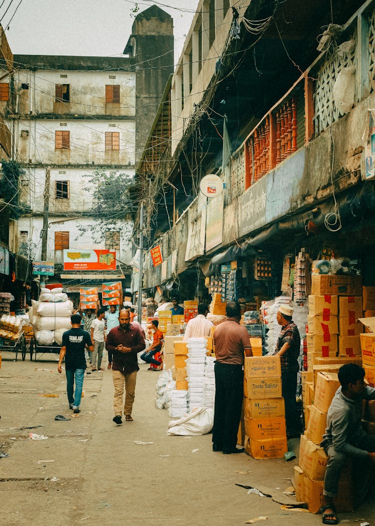 Men On A Traditional Market, And Merchandise In Packaging