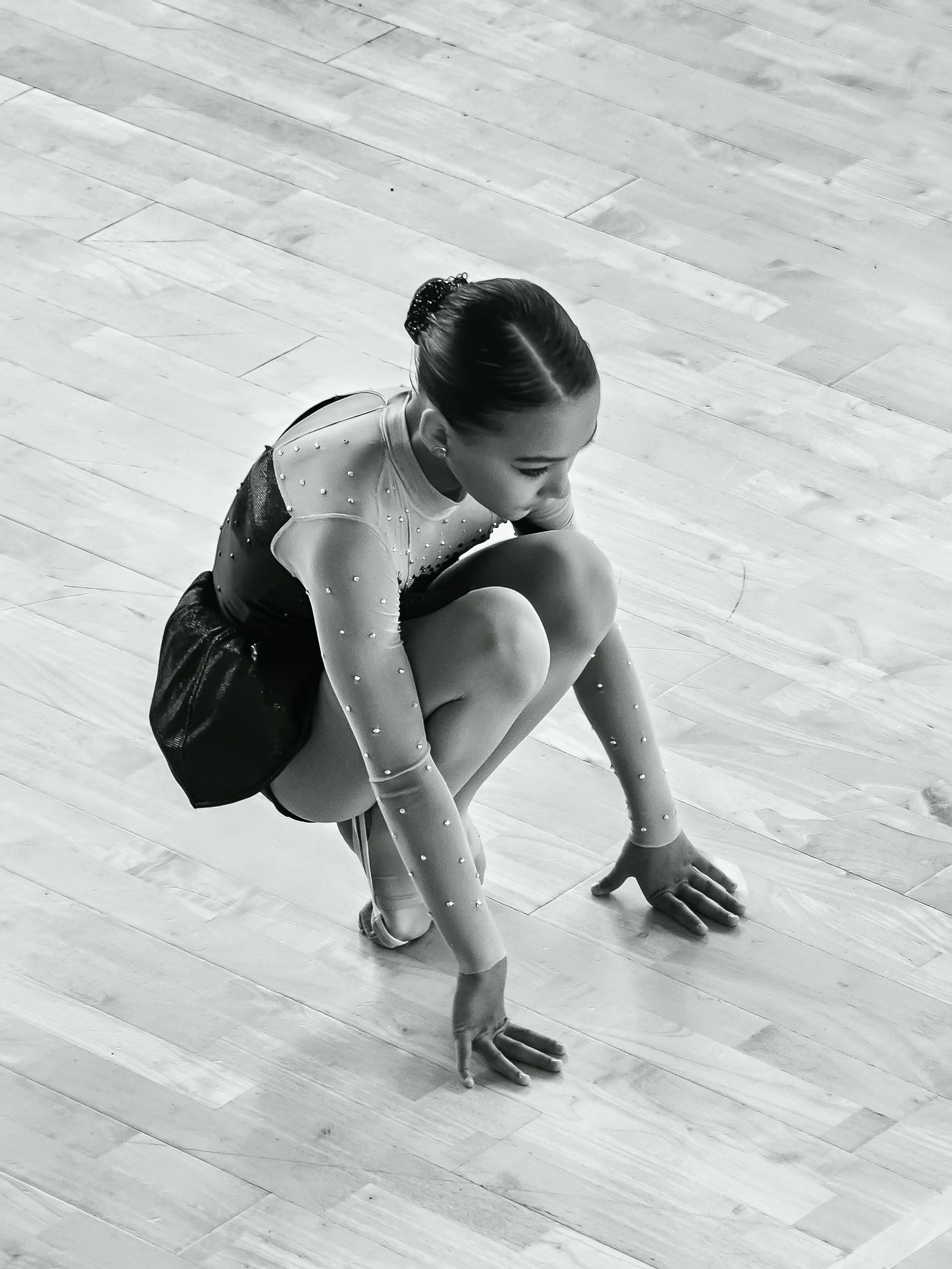 Ballerina Crouching on the Floor · Free Stock Photo
