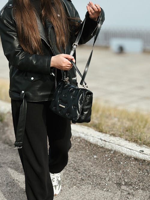 Part of a Woman Body in Black Clothing