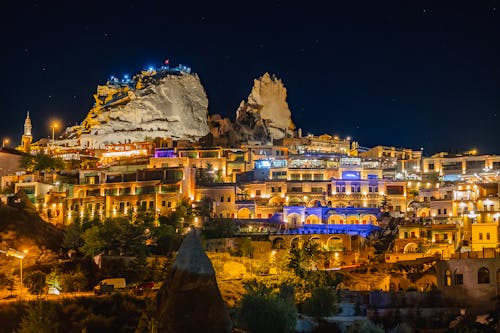 Illuminated Townscape and a Castle on a Rock