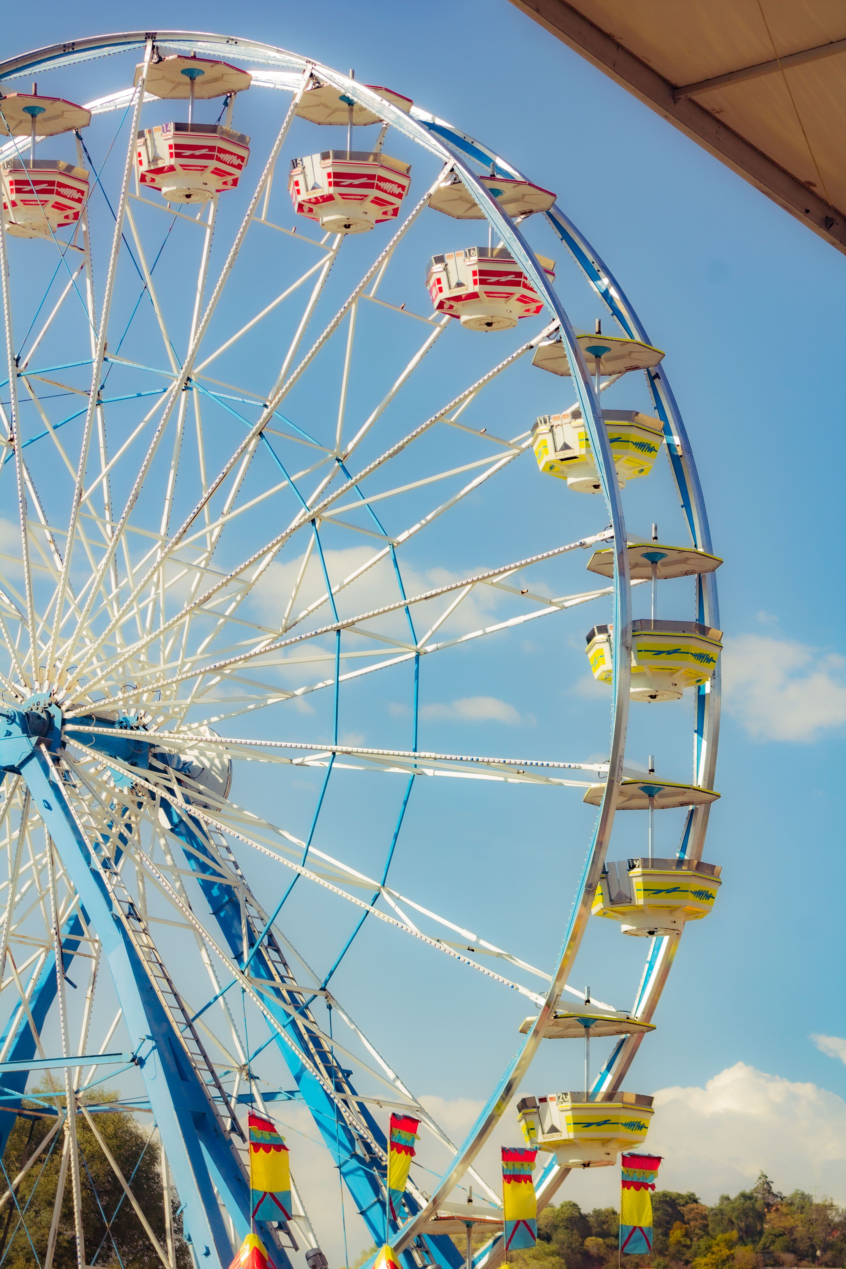 Bright ferris wheel at a fairground in Tlaxcala, Mexico, capturing joy and fun.