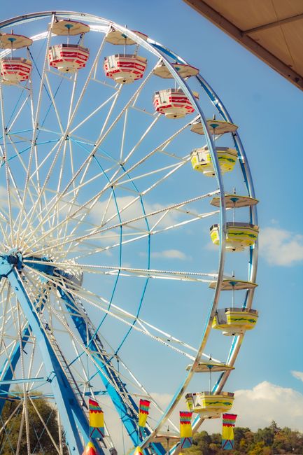 Bright ferris wheel at a fairground in Tlaxcala, Mexico, capturing joy and fun.